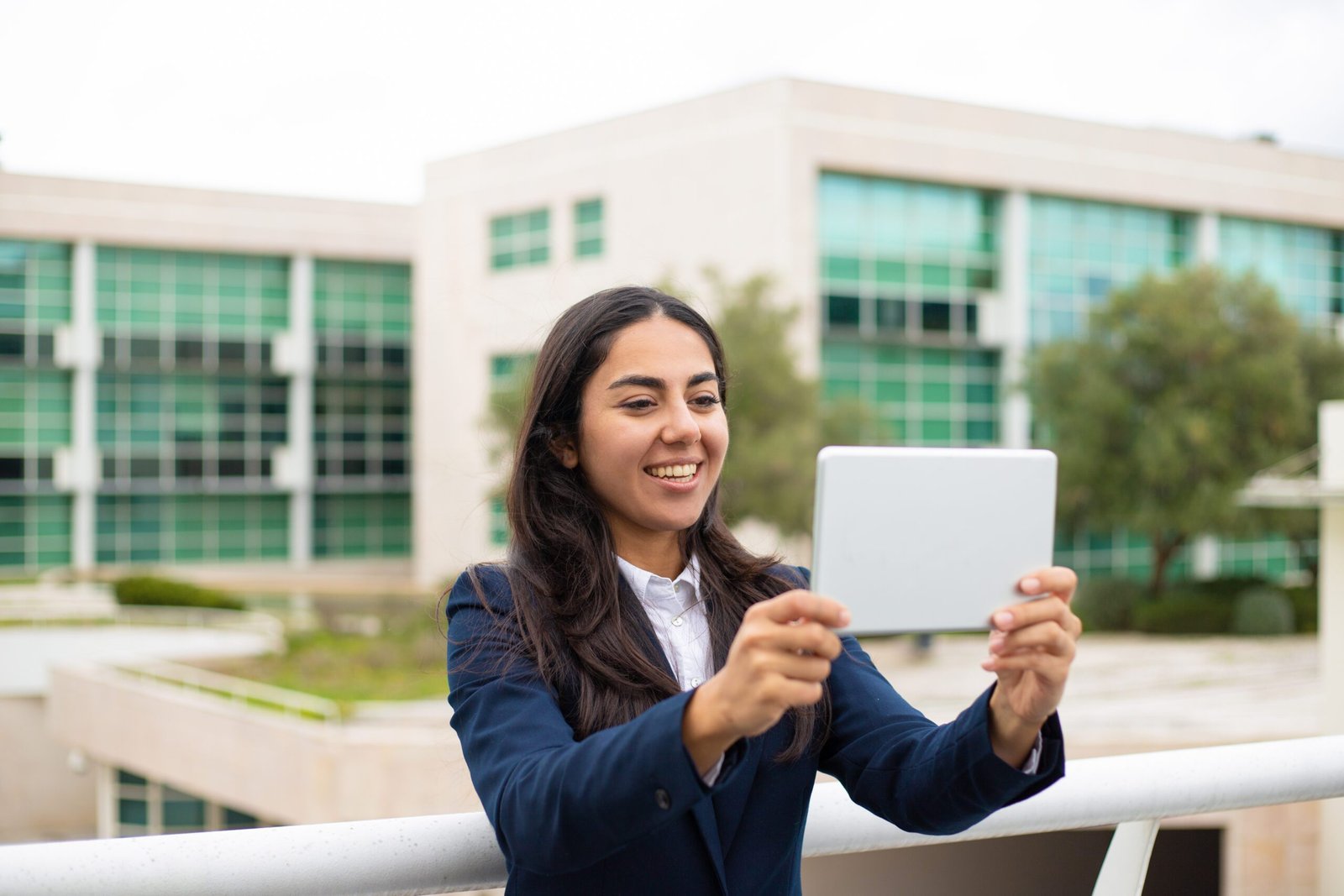 Home 5 content young woman using tablet pc scaled